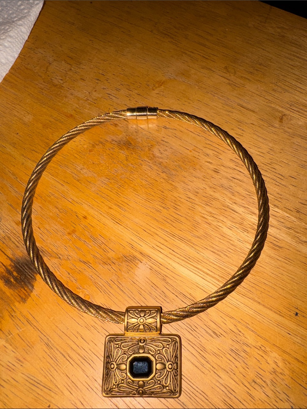 Vintage gold-tone cable wire torque choker w/ slide pendant black cabochon stone